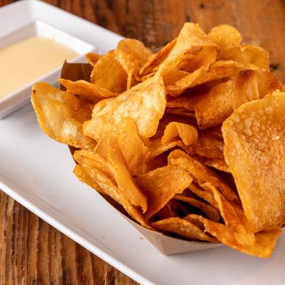 House-Made Potato Chips served with  Monterey-Jack Cheese Sauce.
