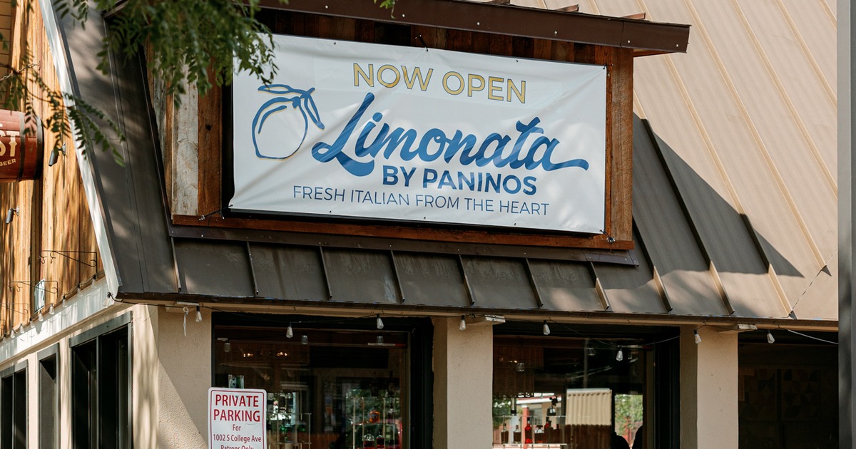 Exterior banner sign for Limonata by Paninos announcing its grand opening