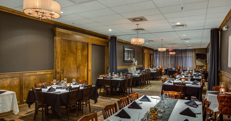 Interior, wide view, tables and chairs lined up