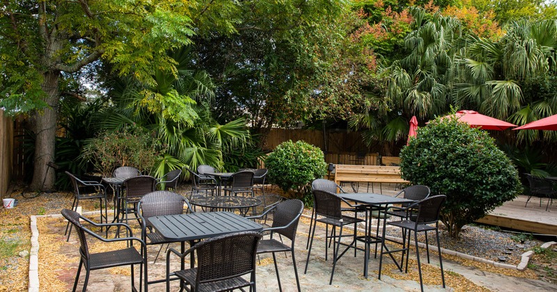 Seating space in the patio with lots of greenery around