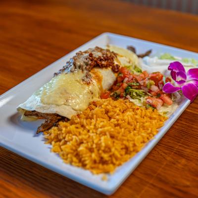 Burrito Campeche served with rice and sour cream salad.