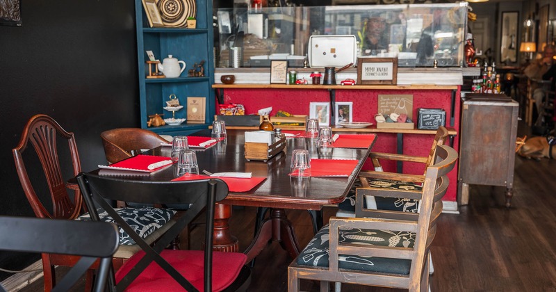 Interior, table ready for guests with counter in the back