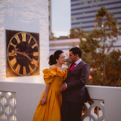 The bride and groom outside in daylight.