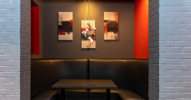 Interior, booths and fine art pictures on the wall