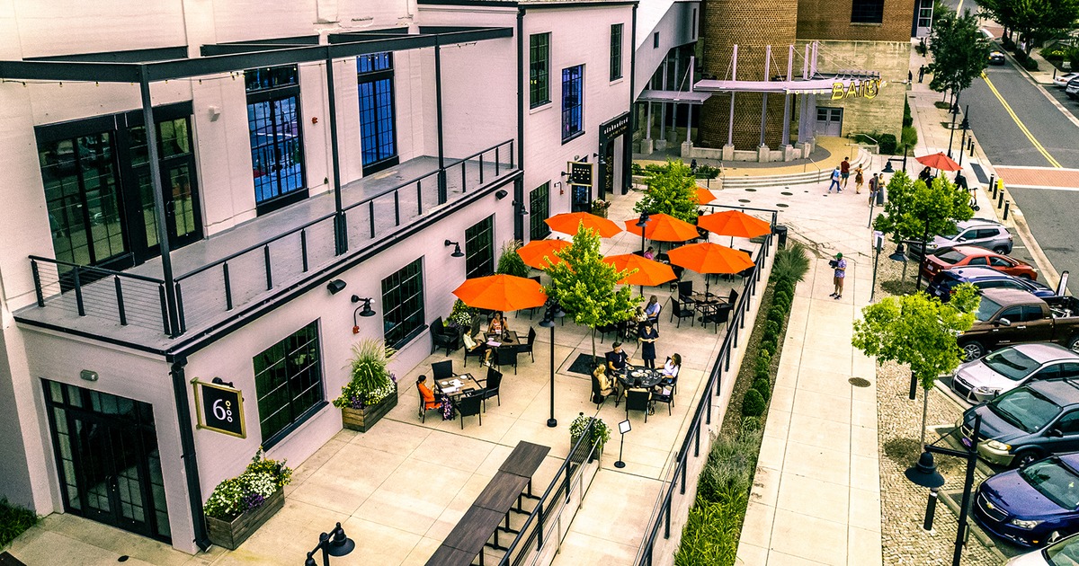 Exterior, areal view of patio with guests in daylight