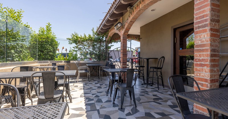Exterior seating area with chairs and tables