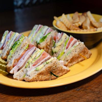 Turkey Club Sandwich and fries.