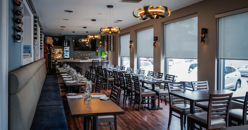 Restaurant interior, dining area with set tables