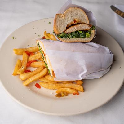 Chicken sandwich with fries.