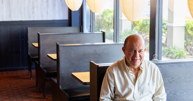 A guest sitting at a table