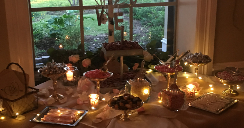 Interior, table with side dishes decorated with candles and string lights