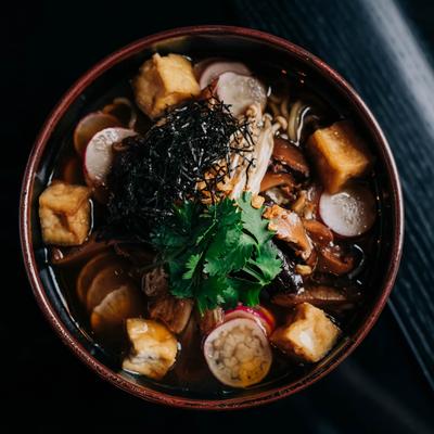 Mushroom Ramen with fried tofu, fried garlic, radish, nori and poached egg.