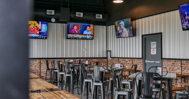 Interior, seating area, TV sets on the wall