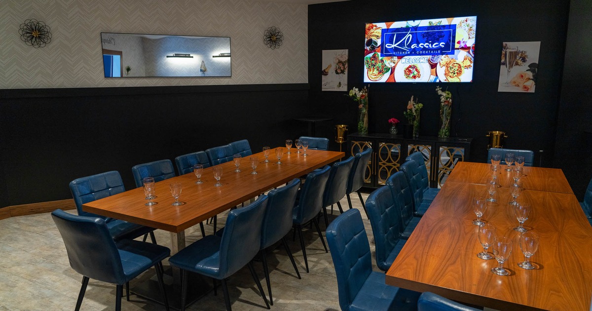Interior, blue chairs around the table