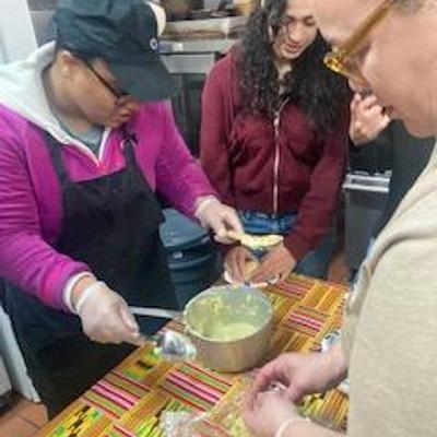 Three people preparing food