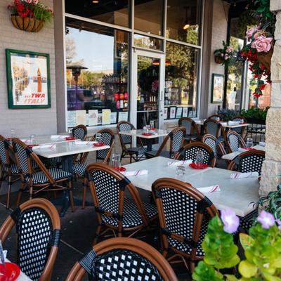 Outdoor seating area, tables and chairs.