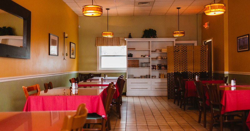 Interior, dining area, tables ready for guests