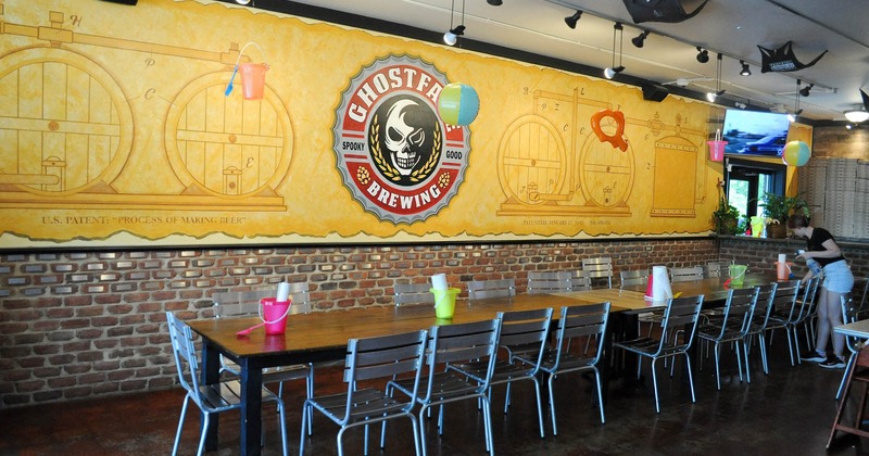 Interior, seating area, wall mural with the Ghostface logo