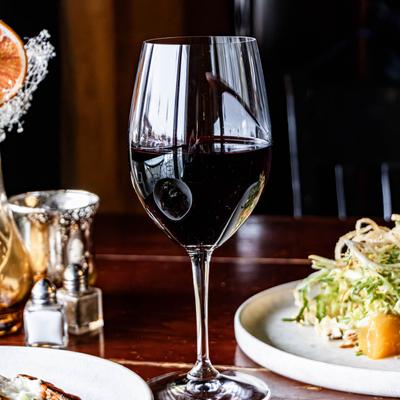 A glass of red wine.