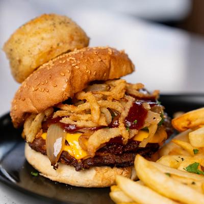 Wagyu angus, stubb's BBQ sauce, caramelized onions, jalapeños, sliced cheddar cheese