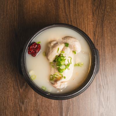 Korean Ginseng Chicken Soup features a whole young chicken stuffed with rice.