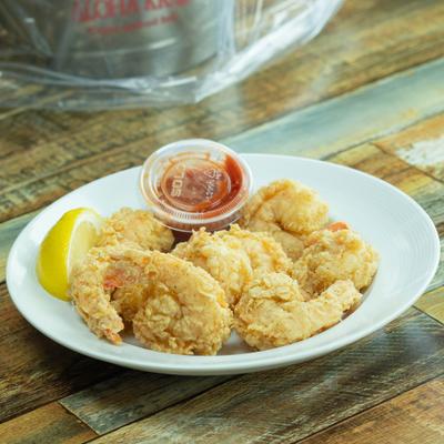 Fried shrimp basket served with lemon and dipping sauce.