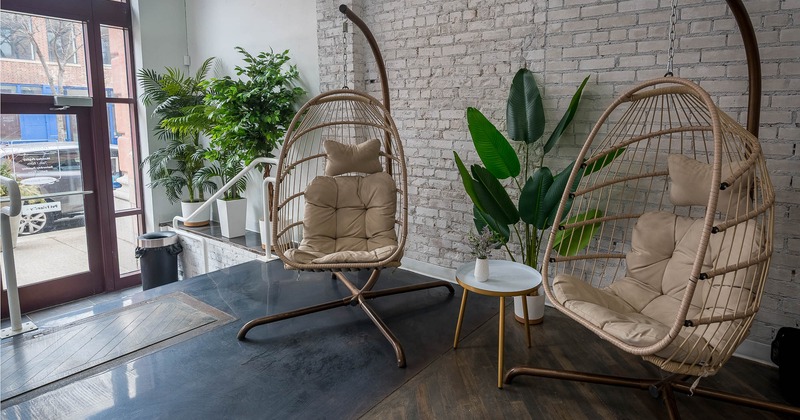 Interior, swing egg chairs with entrance beihind