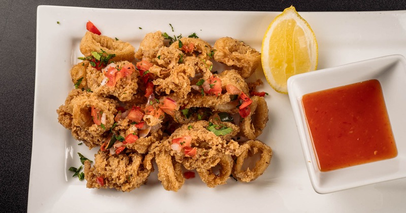 Fried calamari with a side of Thai sweet chili sauce