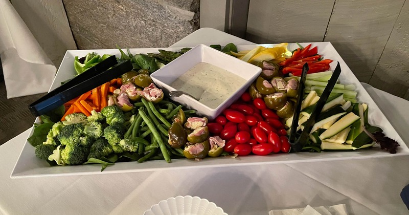 Vegetables salad with a dressing dip on the plate