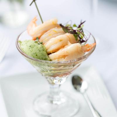 Shrimp cocktail in a martini glass with cucumber gin sorbet.