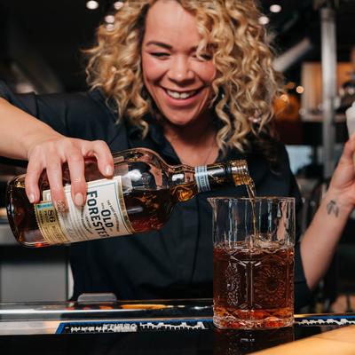 Bartender pouring a whiskey.