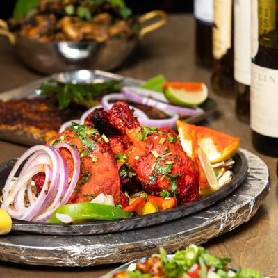 Tandoori chicken, with mixed herbs and vegetables.