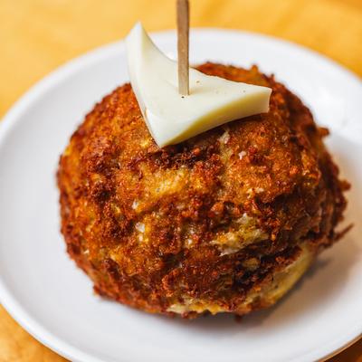 Deep fried and stuffed plantain ball.