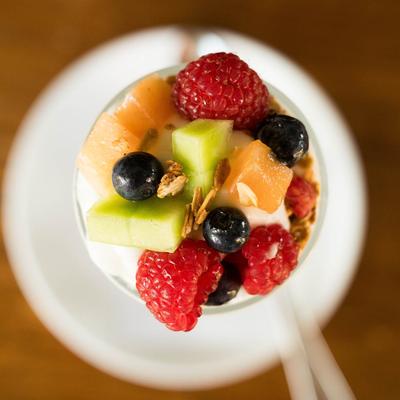 A yogurt cup with fresh fruit.