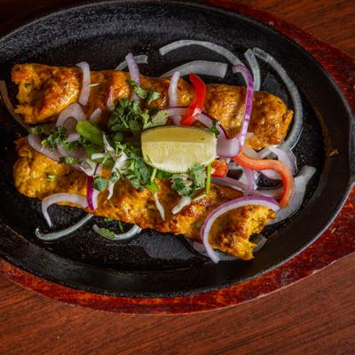 Skewered minced chicken, with onions, herbs, and spices.