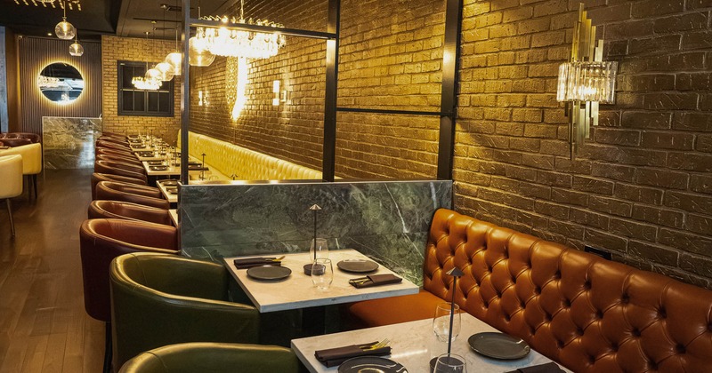 Interior, dining area with tables set for guests