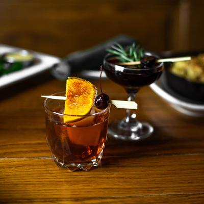 Old Fashioned and Hunting Lodge cocktail on a table.