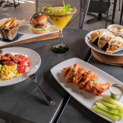 Various food on the table and a Margarita.