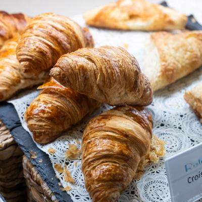 Freshly baked butter croissants, close-up.