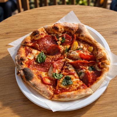 Pizza Diavola topped with pepperoni, red chilies and basil.