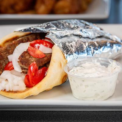 Gyro pita wrap served with tzatziki.