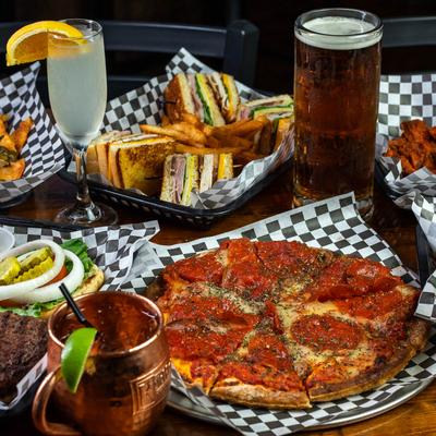 Assorted pub food and drinks on a table.