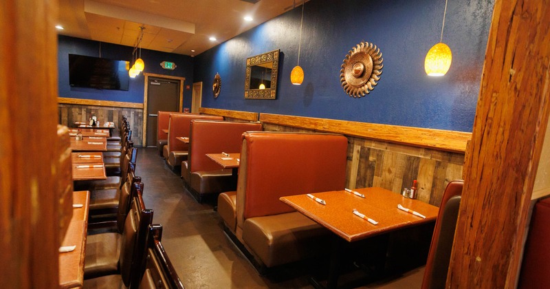 Interior, seating area with booths tables and chairs