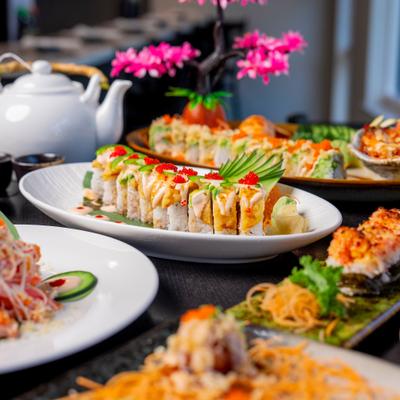 Table full of delicious Sushi.