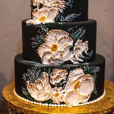 A large cake with intricate decorations.