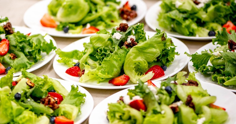 Numereus plates of Summer Berry Salad served on the table