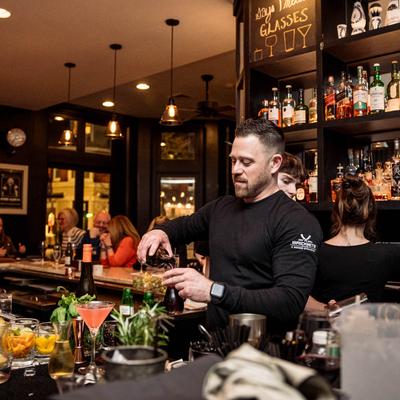A person working behind the bar.