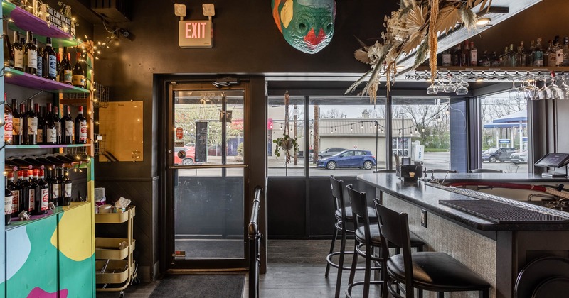 Interior, bar area, restaurant entrance, bar with stools, large shop window
