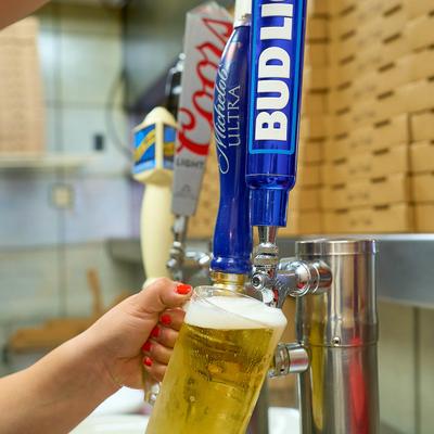 Pouring beer from the tap.