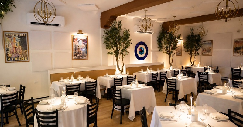 Interior decor featuring a large faux cherry blossom tree and the restaurant wall sign
